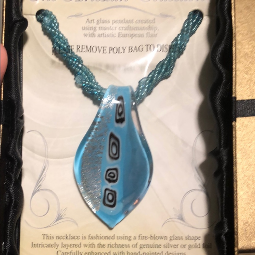 Blue beaded necklace with art glass pendant